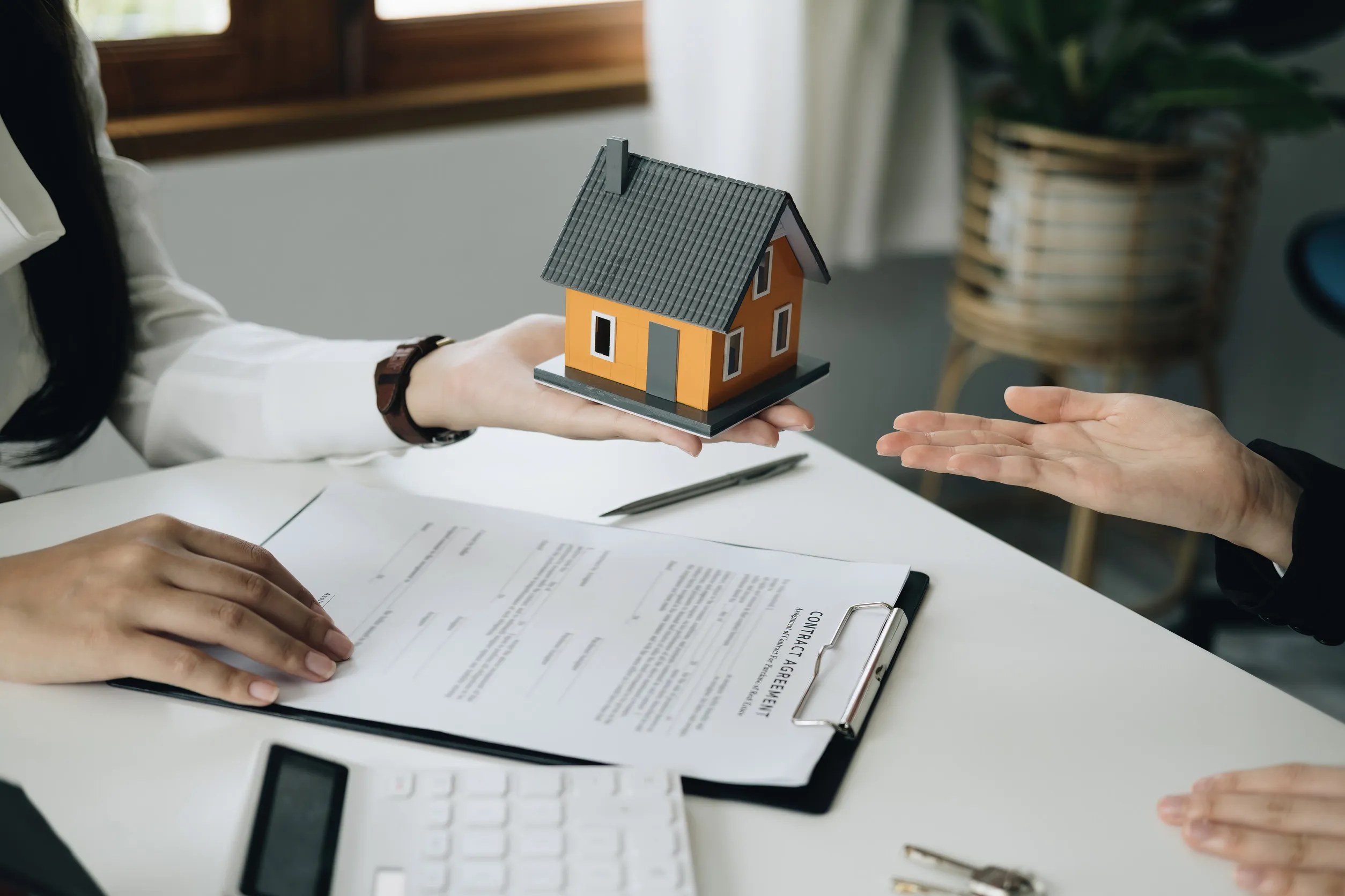 Guarantee, mortgage, agreement, contract, sign, real estate agent delivers the house to the customer after signing important contract documents